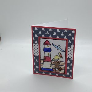 Lighthouse And Pelican Glitter Card