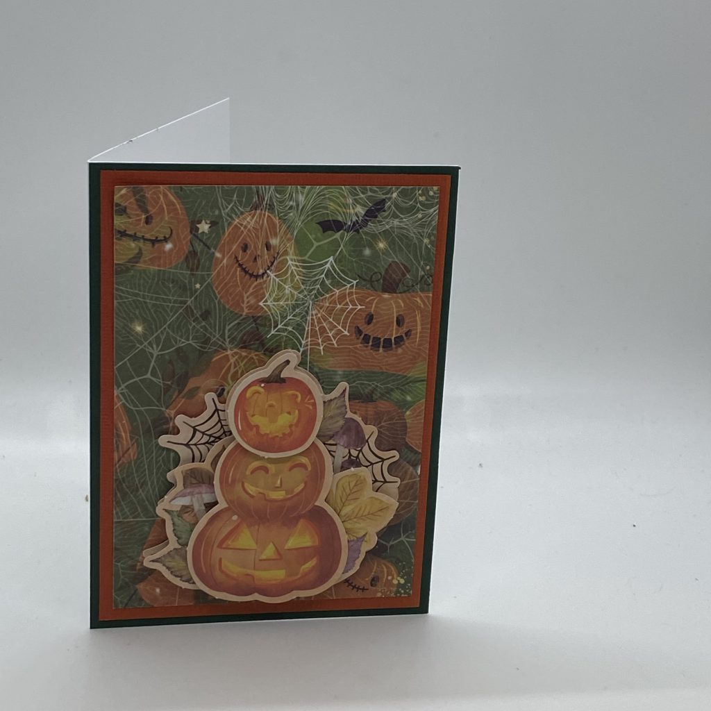 Vertical Stacked Carved Pumpkins Halloween Card.