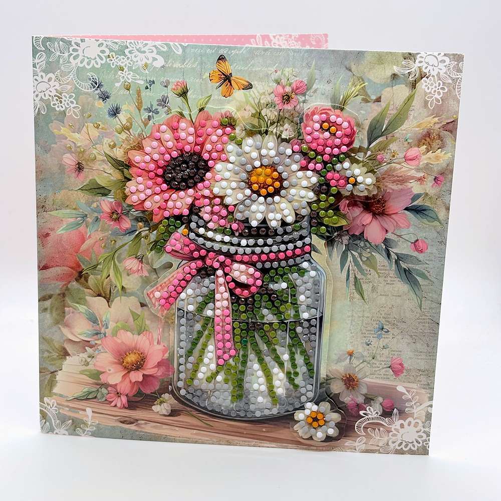 Square thank you card with a glass jar of pink and white flowers tied with a pink bow, made of raised dots over a pastel floral print with white lace corners and a butterfly - Grammy's Grams Handmade Greeting Cards